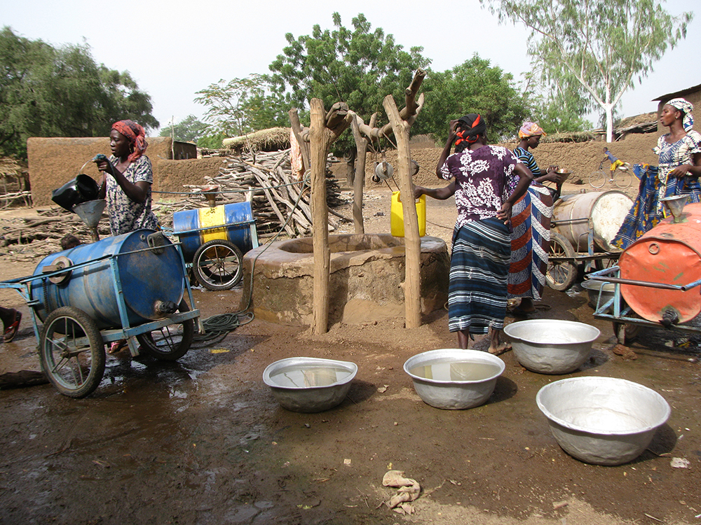 Women collecting water in Burkina Faso