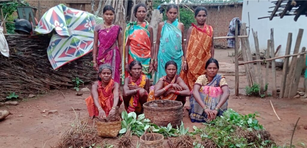 Women from Sandh Karmari village displaying the forest foods that they have gathered